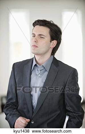 Close-up of a businessman thinking View Large Photo Image Stock Photo - Close-up of a businessman thinking. Fotosearch