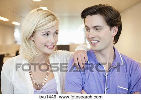 Close-up of a couple smiling at each other View Large Photo Image Stock Photo - Close-up of a couple smiling at each other. Fotosearch