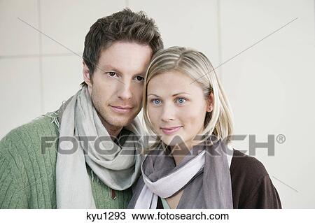 Stock Image - Close-up of a couple standing together. Fotosearch