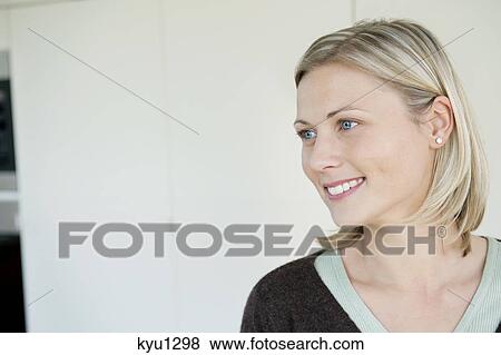 Stock Photo - Close-up of a woman smiling. Fotosearch