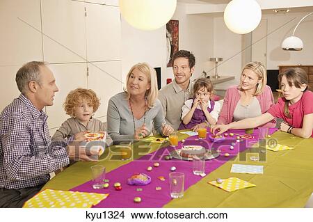 Picture - Family at a birthday celebration. Fotosearch