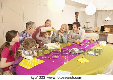 Family at a birthday celebration View Large Photo Image Stock Image - Family at a birthday celebration. Fotosearch
