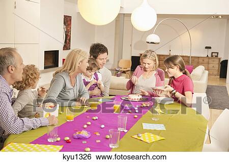 Family at a birthday celebration View Large Photo Image Stock Photograph - Family at a birthday celebration. Fotosearch