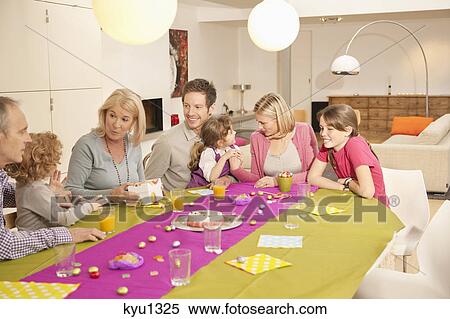 Family at a birthday celebration View Large Photo Image Stock Photography - Family at a birthday celebration. Fotosearch