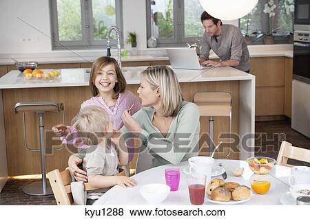 Family at a breakfast table View Large Photo Image Stock Photo - Family at a breakfast table. Fotosearch