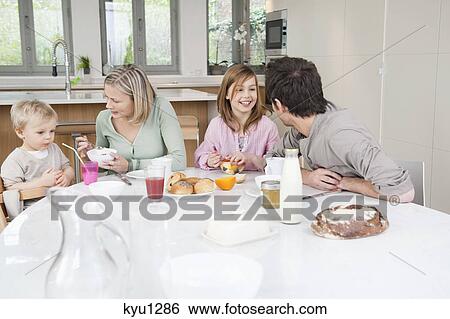 Stock Photograph - Family at a breakfast table. Fotosearch