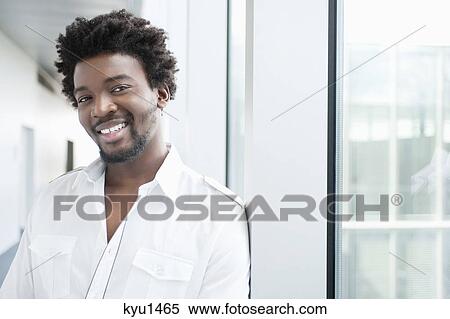 Portrait of a businessman smiling View Large Photo Image Stock Photography - Portrait of a businessman smiling. Fotosearch