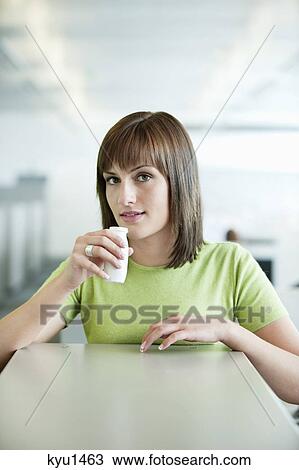 Portrait of a businesswoman drinking probiotic drink View Large Photo Image Stock Image - Portrait of a businesswoman drinking probiotic drink. Fotosearch