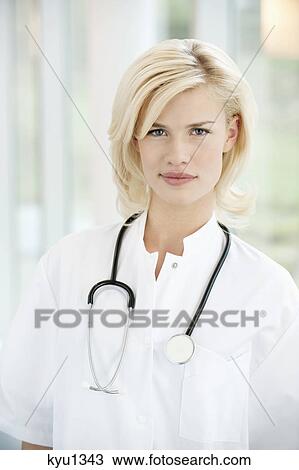 Portrait of a female doctor smiling View Large Photo Image Stock Image - Portrait of a female doctor smiling. Fotosearch