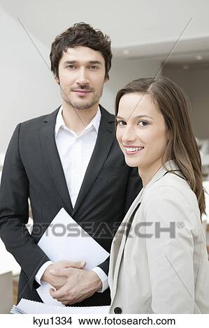 Portrait of two business executives smiling View Large Photo Image Picture - Portrait of two business executives smiling. Fotosearch