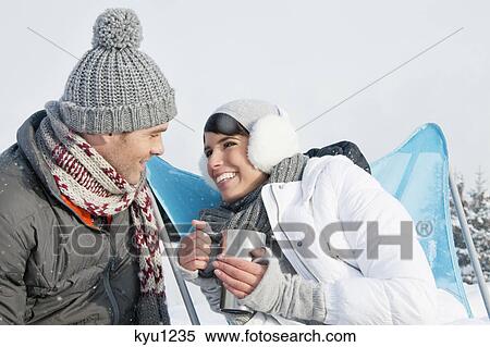 Young couple in ski wear resting View Large Photo Image Stock Photography - Young couple in ski wear resting. Fotosearch