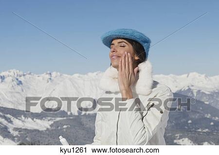 Young woman applying moisturizer View Large Photo Image Stock Image - Young woman applying moisturizer. Fotosearch
