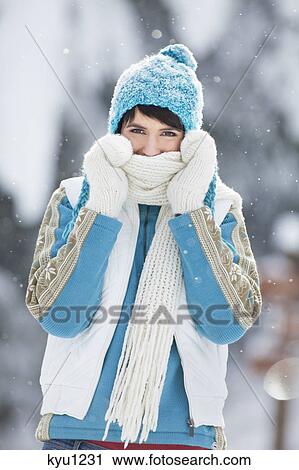 Young woman in winter clothes smiling at camera View Large Photo Image Stock Image - Young woman in winter clothes smiling at camera. Fotosearch