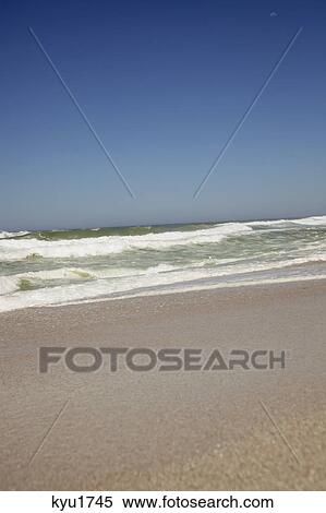 Beautiful view of beach against clear sky View Large Photo Image Stock Photography - Beautiful view of beach against clear sky. Fotosearch