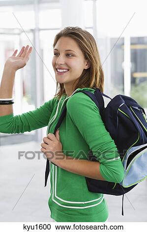 Beautiful woman waving her hand and smiling View Large Photo Image Stock Image - Beautiful woman waving her hand and smiling. Fotosearch