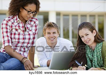 Friends studying in a campus View Large Photo Image Stock Photograph - Friends studying in a campus. Fotosearch