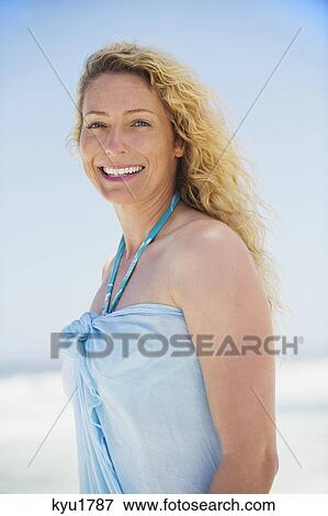 Stock Photo - Portrait of a beautiful woman smiling. Fotosearch