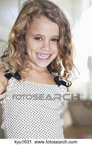 Portrait of a cute little girl smiling View Large Photo Image Stock Image - Portrait of a cute little girl smiling. Fotosearch