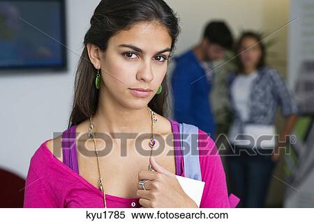 Portrait of a female university student holding a book View Large Photo Image Stock Photography - Portrait of a female university student holding a book. Fotosearch