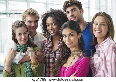 Portrait of multi-ethnic university students standing together View Large Photo Image Stock Photo - Portrait of multi-ethnic university students standing together. Fotosearch