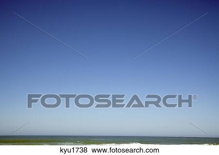 Sea against clear blue sky View Large Photo Image Stock Photo - Sea against clear blue sky. Fotosearch