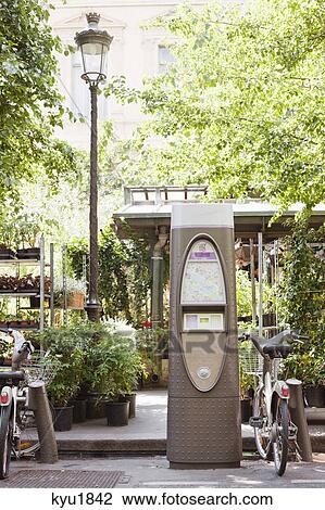 Bicycles parked near a ticket machine, Paris, Ile-de-France, France View Large Photo Image Stock Image - Bicycles parked near a ticket machine, Paris, Ile-de-France, France. Fotosearch
