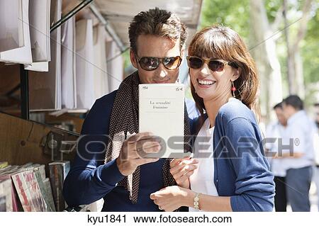 Couple at a book stall, Paris, Ile-de-France, France View Large Photo Image Stock Image - Couple at a book stall, Paris, Ile-de-France, France. Fotosearch
