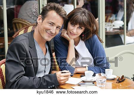 Couple sitting in a restaurant, Paris, Ile-de-France, France View Large Photo Image Stock Photograph - Couple sitting in a restaurant, Paris, Ile-de-France, France. Fotosearch