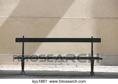 Stock Photo - Empty bench in a garden, Terrasse De l'Orangerie, Jardin des Tuileries, Paris, Ile-de-France, France. Fotosearch