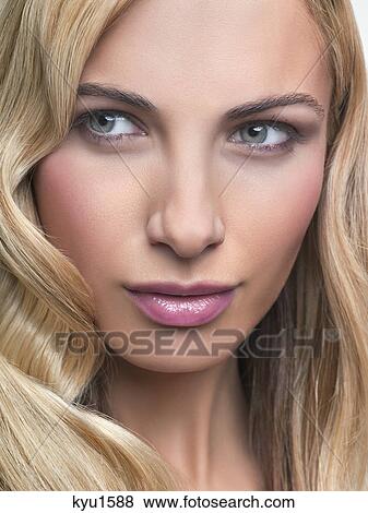 Stock Photo - Young woman looking away. Fotosearch