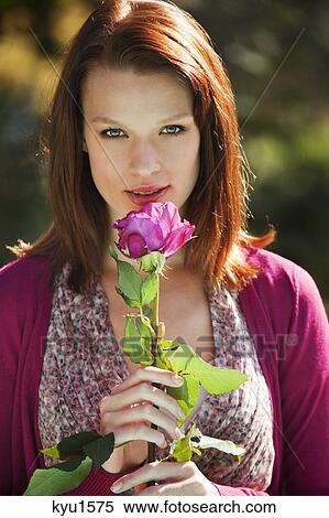 Young woman smelling rose View Large Photo Image Stock Photography - Young woman smelling rose. Fotosearch