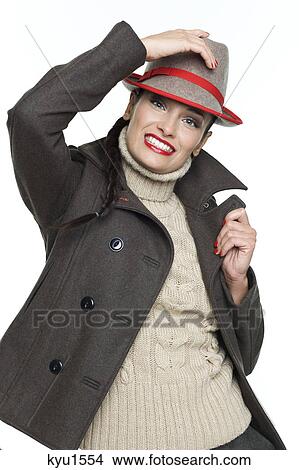 Picture - Young woman wearing jacket and fedora. Fotosearch