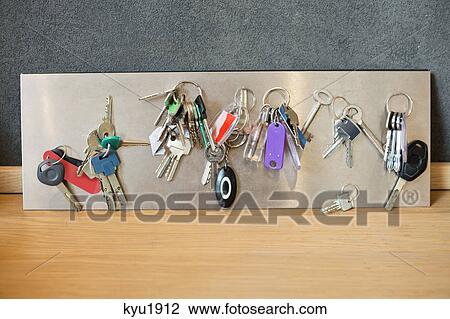 Assorted keys on a metal sheet View Large Photo Image Stock Image - Assorted keys on a metal sheet. Fotosearch