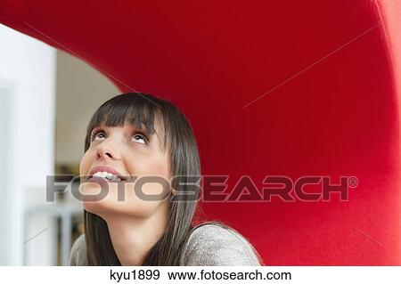Close-up of a businesswoman day dreaming View Large Photo Image Stock Photo - Close-up of a businesswoman day dreaming. Fotosearch
