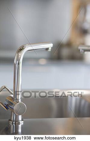 Stock Photo - Close-up of a faucet. Fotosearch