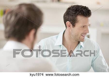 Picture - Man smiling with his friend. Fotosearch