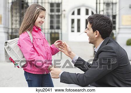 Man talking to his daughter View Large Photo Image Stock Image - Man talking to his daughter. Fotosearch