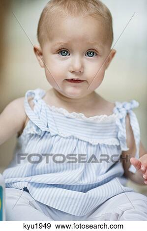 Stock Photo - Portrait of a baby girl. Fotosearch