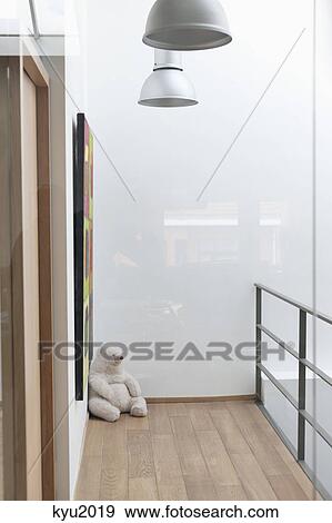 Teddy bear in the corner of a house View Large Photo Image Stock Photo - Teddy bear in the corner of a house. Fotosearch
