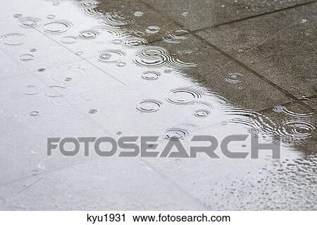 Stock Image - Wet street during rain. Fotosearch