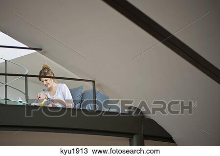 Woman feeding her daughter View Large Photo Image Stock Image - Woman feeding her daughter. Fotosearch