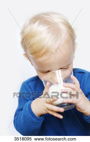 2 years old boy drinking a glass of milk View Large Photo Image Stock Photography - 2 years old boy drinking a glass of milk. Fotosearch