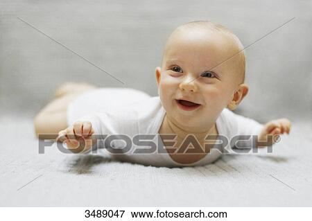 8 months baby boy lying down View Large Photo Image Stock Photo - 8 months baby boy lying down. Fotosearch