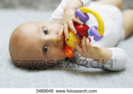 8 months baby boy lying down View Large Photo Image Stock Photo - 8 months baby boy lying down. Fotosearch