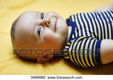 8 months baby boy lying down View Large Photo Image Stock Photo - 8 months baby boy lying down. Fotosearch