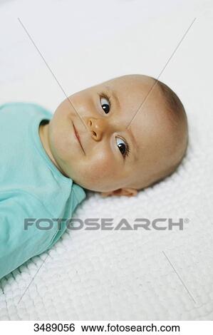 8 months baby boy lying down View Large Photo Image Stock Photograph - 8 months baby boy lying down. Fotosearch
