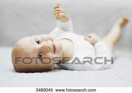 8 months baby boy lying down View Large Photo Image Stock Photography - 8 months baby boy lying down. Fotosearch