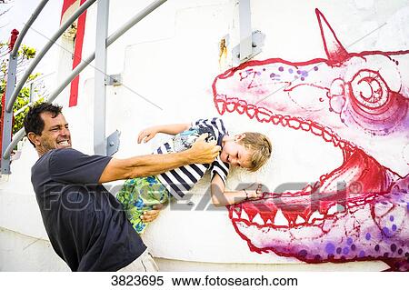 A father and his son are playing with a graph Gosier island, Guadeloupe, France View Large Photo Image Stock Photography - A father and his son are playing with a graph Gosier island, Guadeloupe, France. Fotosearch