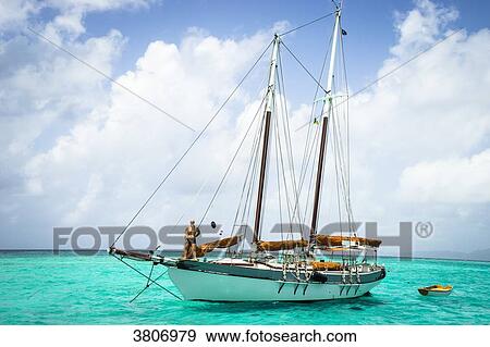A man on his shooner, Reserve, Tobago Cays, Saint-Vincent and the Grenadines, West Indies View Large Photo Image Stock Photo - A man on his shooner, Reserve, Tobago Cays, Saint-Vincent and the Grenadines, West Indies. Fotosearch