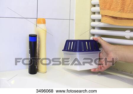 Stock Photo - A moisture absorber in a bathroom. Fotosearch
